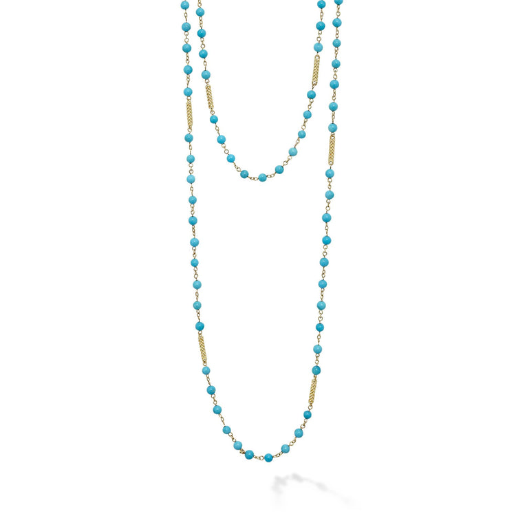 This vibrant turquoise beaded necklace is accented with 18k caviar gold beading, perfect for layering or wearing solo.