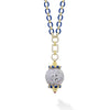 This stunning pendant necklace features a beautifully hand-carved lavender jade ball, accentuated by rich blue sapphires set in 18k gold, adding a touch of sophistication. The pendant hangs from our signature blue ceramic with diamonds, adding brilli