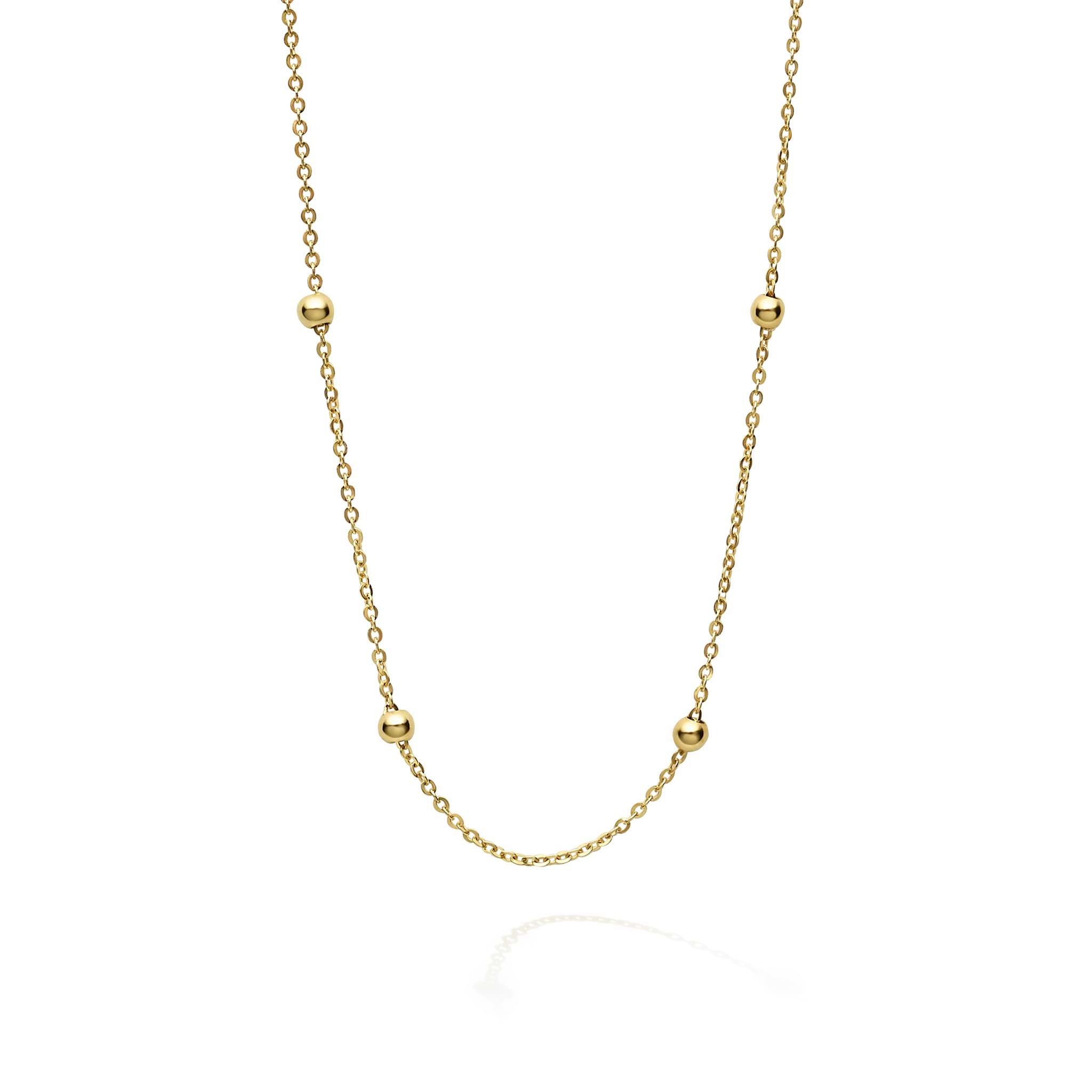 A signature layering piece. 18K gold bead stations on a gold chain.
