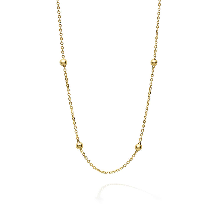 A signature layering piece. 18K gold bead stations on a gold chain.