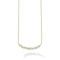 Nineteen bezel-cut diamond horizonal pendant on a 18K gold beaded chain with white background
