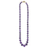 18k gold, smooth amethyst cabochon, and tsavorite garnet gemstones form this statement necklace.