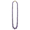 18k gold, hand carved fluted amethyst cabochon, and tsavorite garnet gemstones form this statement necklace.