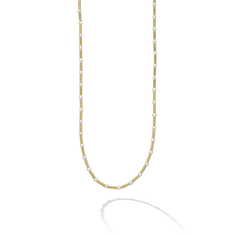 This exquisite 18K gold necklaces features signature Caviar beading and luxurious freshwater cultured pearls.
