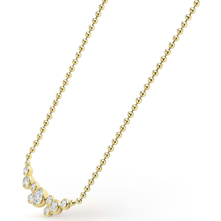 Zoom in on nine bezel-cut diamond horizonal pendant on a 18K gold beaded chain with white background
