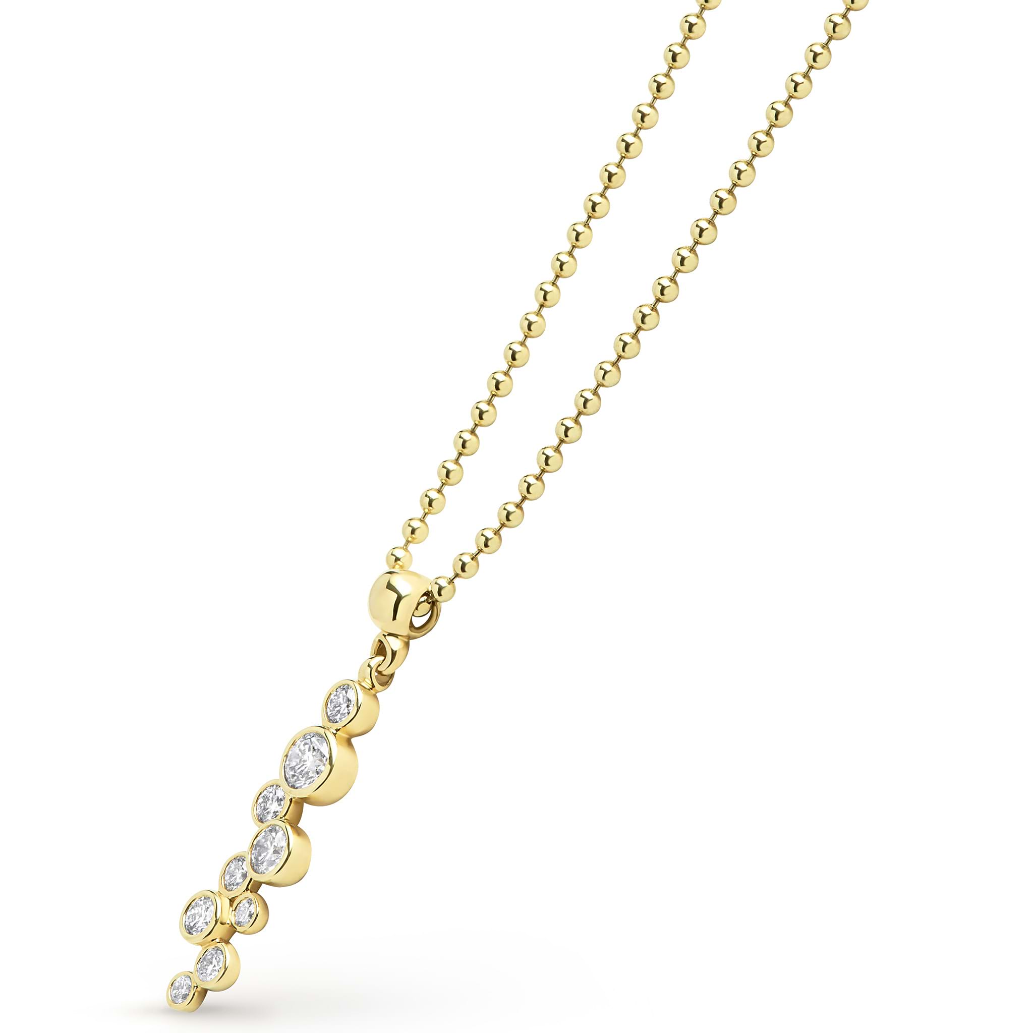 Zoom in of nine bezel-cut diamond pendant on a 18K gold beaded chain with white background