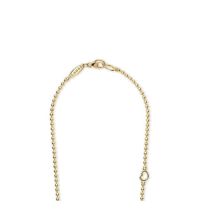 18K gold beaded necklace with lobster clasp and LAGOS engraving on a white background