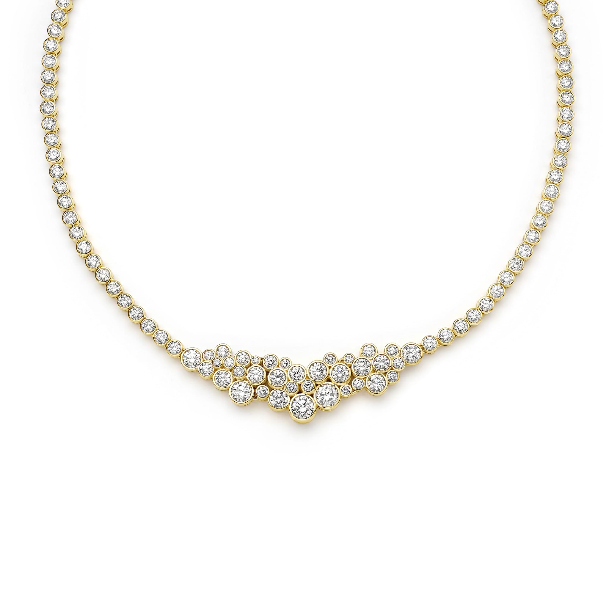 Gold necklace with clear stones on a white background