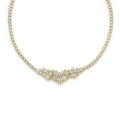 Gold necklace with clear stones on a white background