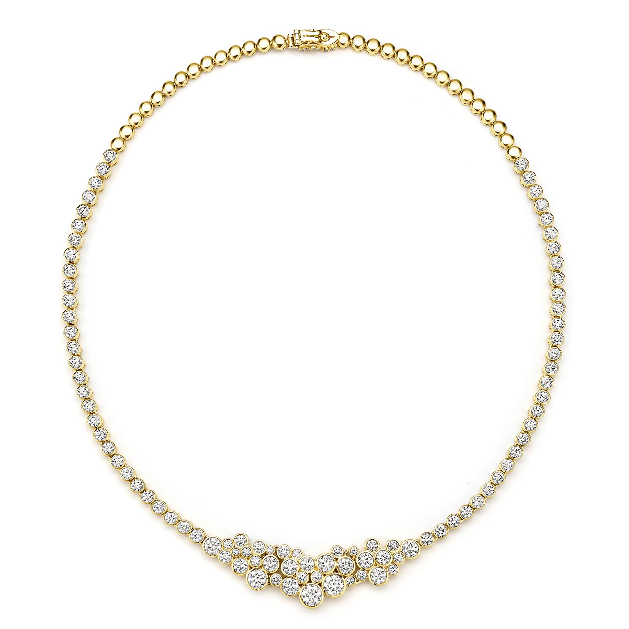 Gold necklace with diamond accents on a white background