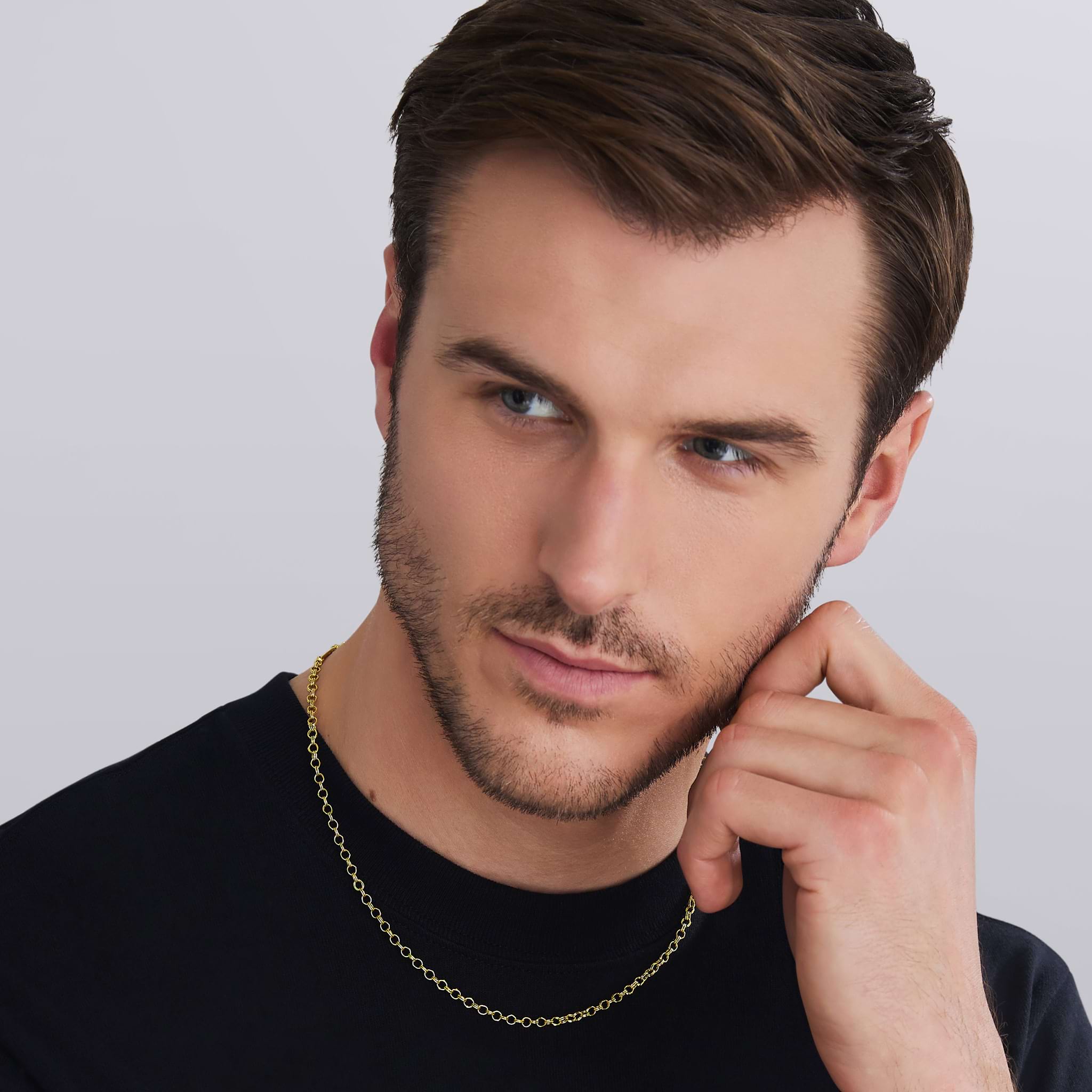 man wearing 18K gold High Jinks link chain necklace by LAGOS, Anthem collection, 3.5 mm width