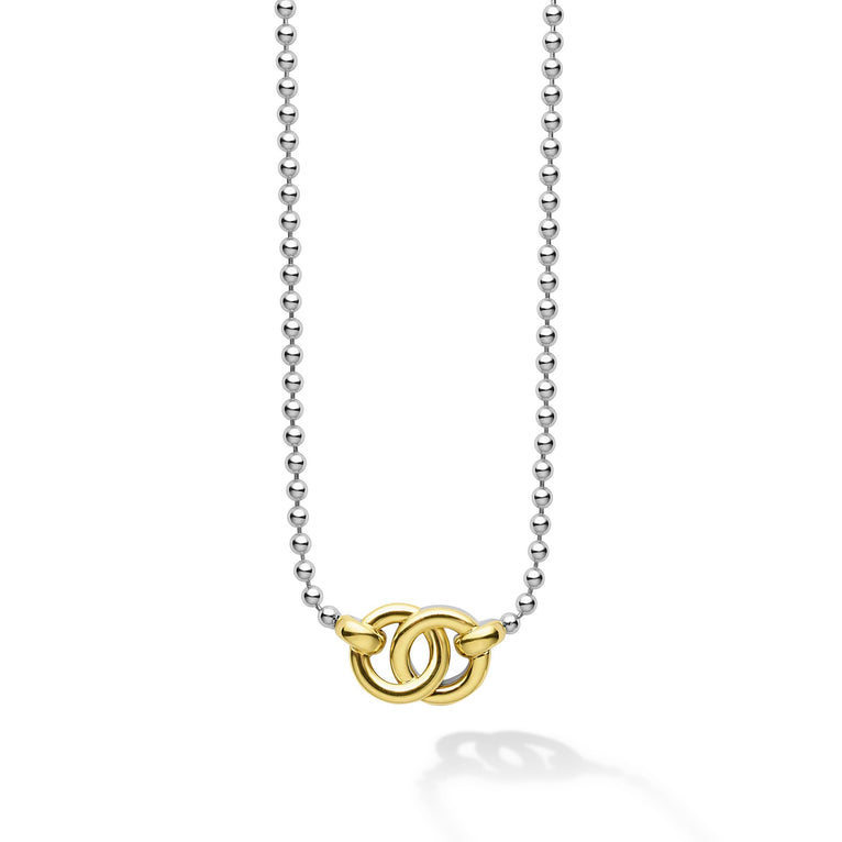 18K gold and sterling silver forms this interlocking pendant necklace.