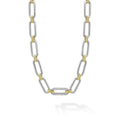 Sterling silver & 18K gold variations of Caviar beading & fluting elements accented by a single diamond station form this oval link necklace. LAGOS diamonds are the highest quality natural stones.