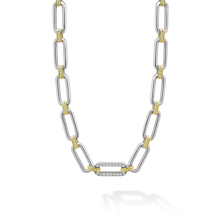 Sterling silver & 18K gold variations of Caviar beading & fluting elements accented by a single diamond station form this oval link necklace. LAGOS diamonds are the highest quality natural stones.