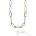 Sterling silver & 18K gold variations of Caviar beading & fluting elements accented by three diamond stations form this oval link necklace. LAGOS diamonds are the highest quality natural stones.