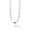 Keshi pearl stations highlighted with Caviar beaded spheres on a signature sterling silver 34 inch necklace.