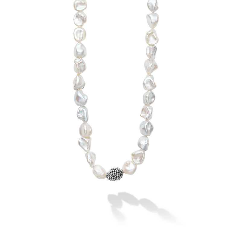 Keshi pearl stations highlighted with Caviar beaded spheres on a signature sterling silver 34 inch necklace.