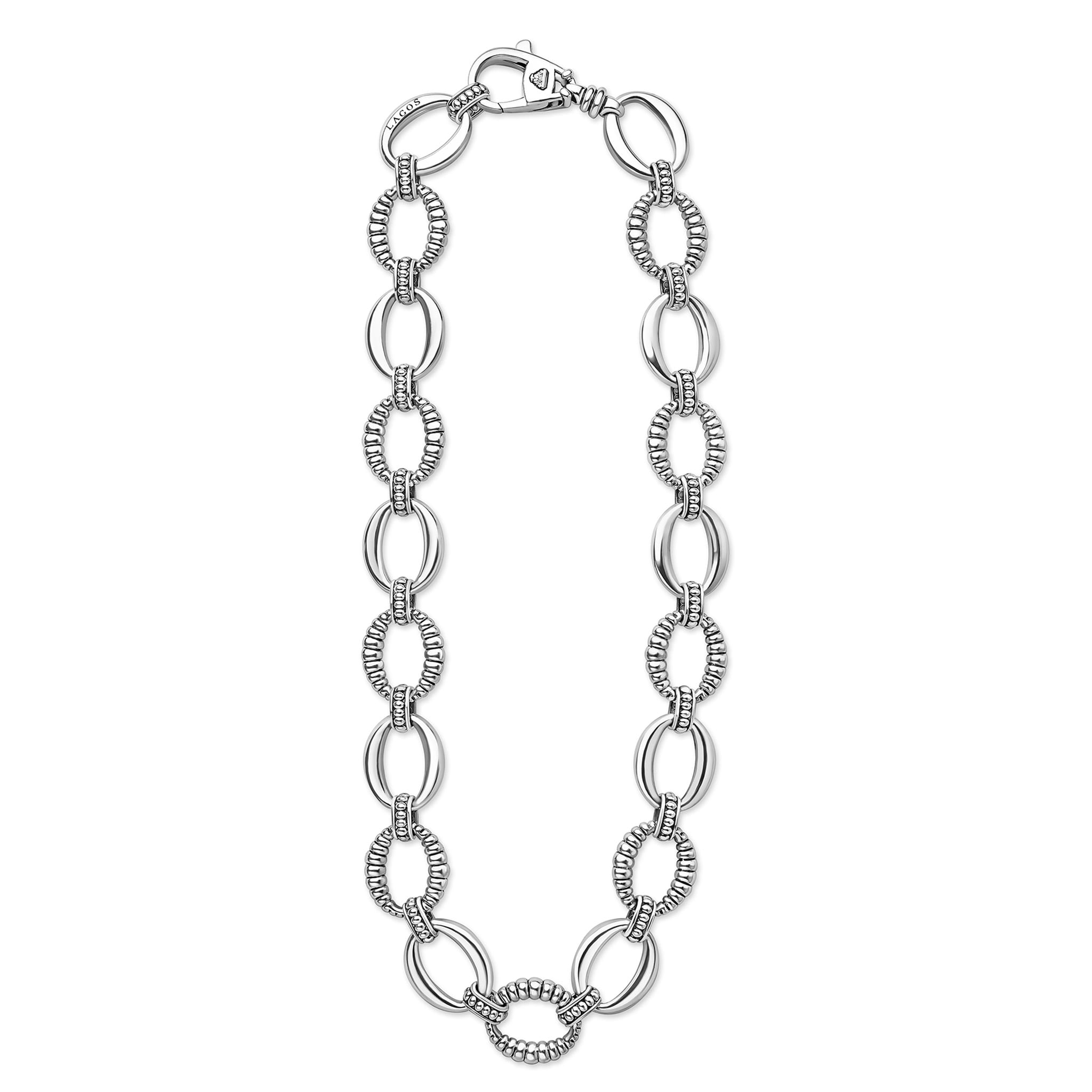Sterling silver necklace with alternating polished and textured oval links, featuring a lobster-claw clasp engraved with LAGOS. Signature Caviar Sterling Silver Oval Fluted Link Necklace.
