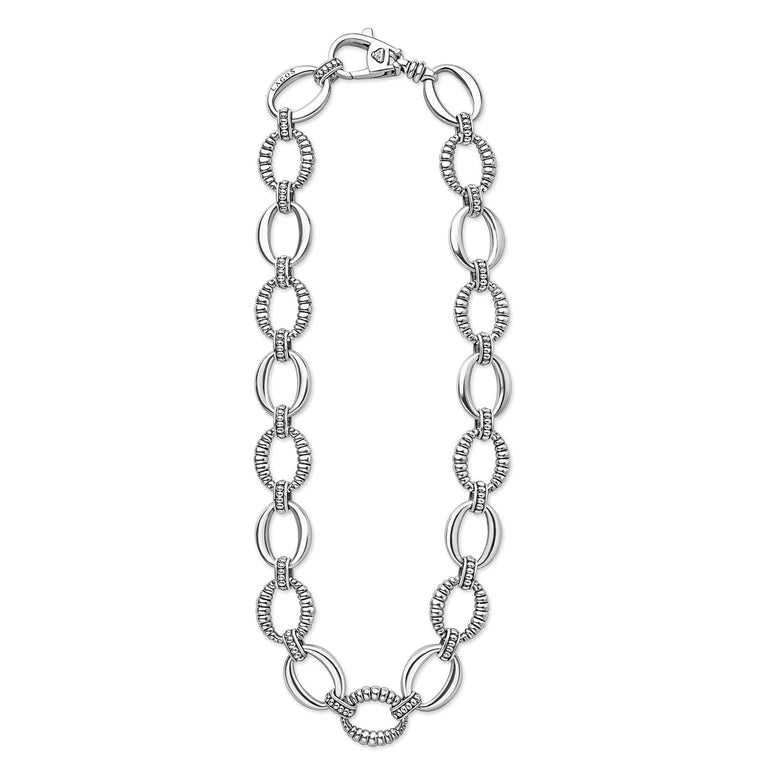 Sterling silver necklace with alternating polished and textured oval links, featuring a lobster-claw clasp engraved with LAGOS. Signature Caviar Sterling Silver Oval Fluted Link Necklace.