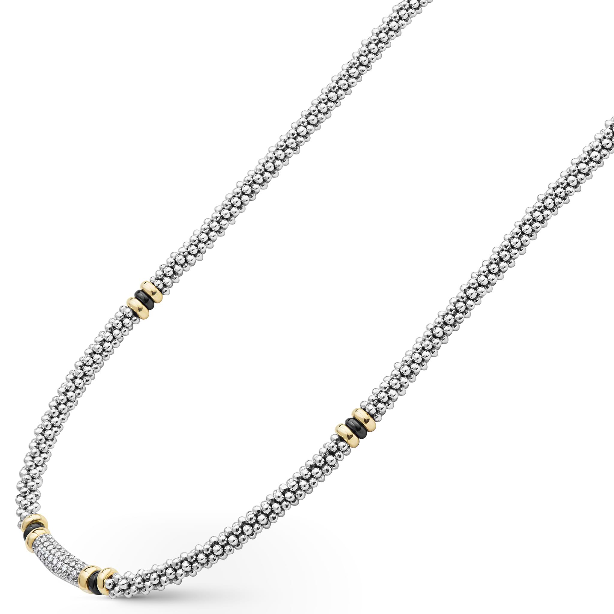side of sterling silver beaded statement necklace with black ceramic and gold stations and diamonds