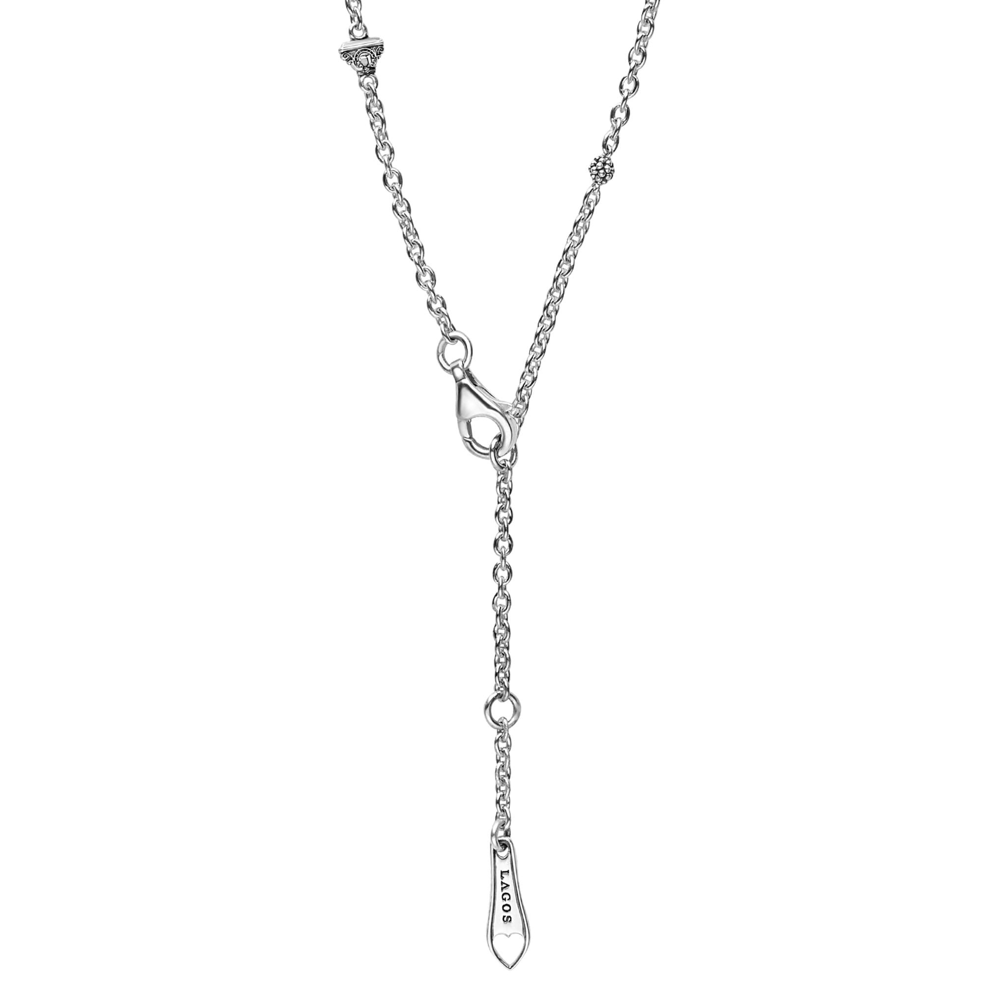 Caviar Bubbly Silver Beaded Station Necklace in sterling silver with polished bubble-shaped stations and a spoon-shaped pendant engraved with LAGOS featuring a heart cut-out.