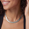 Woman wearing the Caviar Bubbly Sterling Silver Disc Necklace
