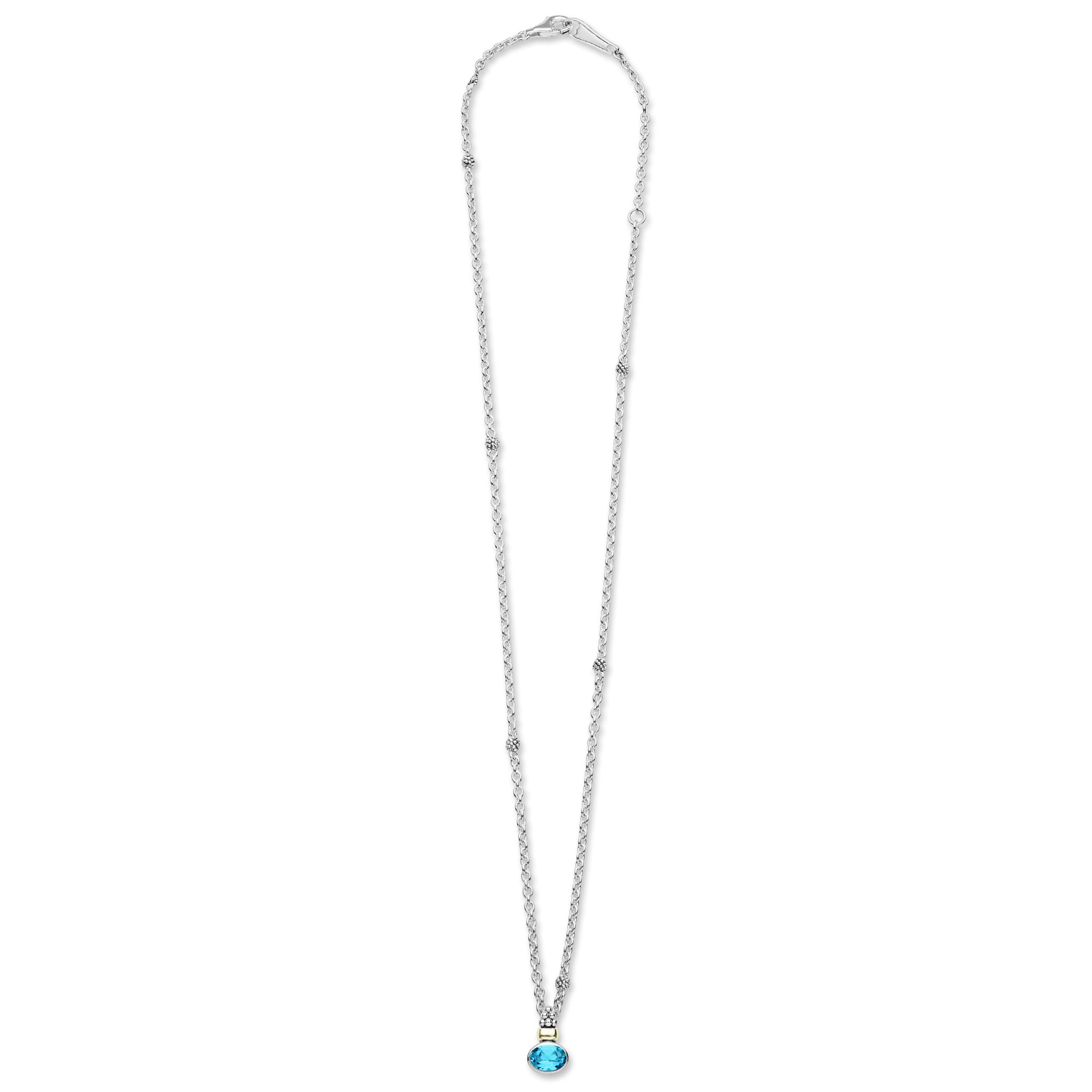 Signature Caviar Two-Tone Swiss Blue Topaz Oval Pendant Necklace with sterling silver chain, 18K gold accents, and caviar beading, showcasing an oval Swiss blue topaz gemstone.