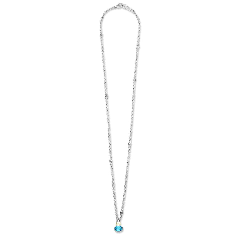 Signature Caviar Two-Tone Swiss Blue Topaz Oval Pendant Necklace with sterling silver chain, 18K gold accents, and caviar beading, showcasing an oval Swiss blue topaz gemstone.