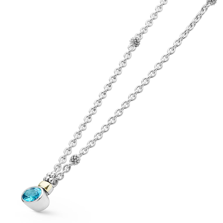 Signature Caviar Two-Tone Swiss Blue Topaz Oval Pendant Necklace with sterling silver and 14K gold accents, featuring a faceted blue topaz in an elegant oval setting.
