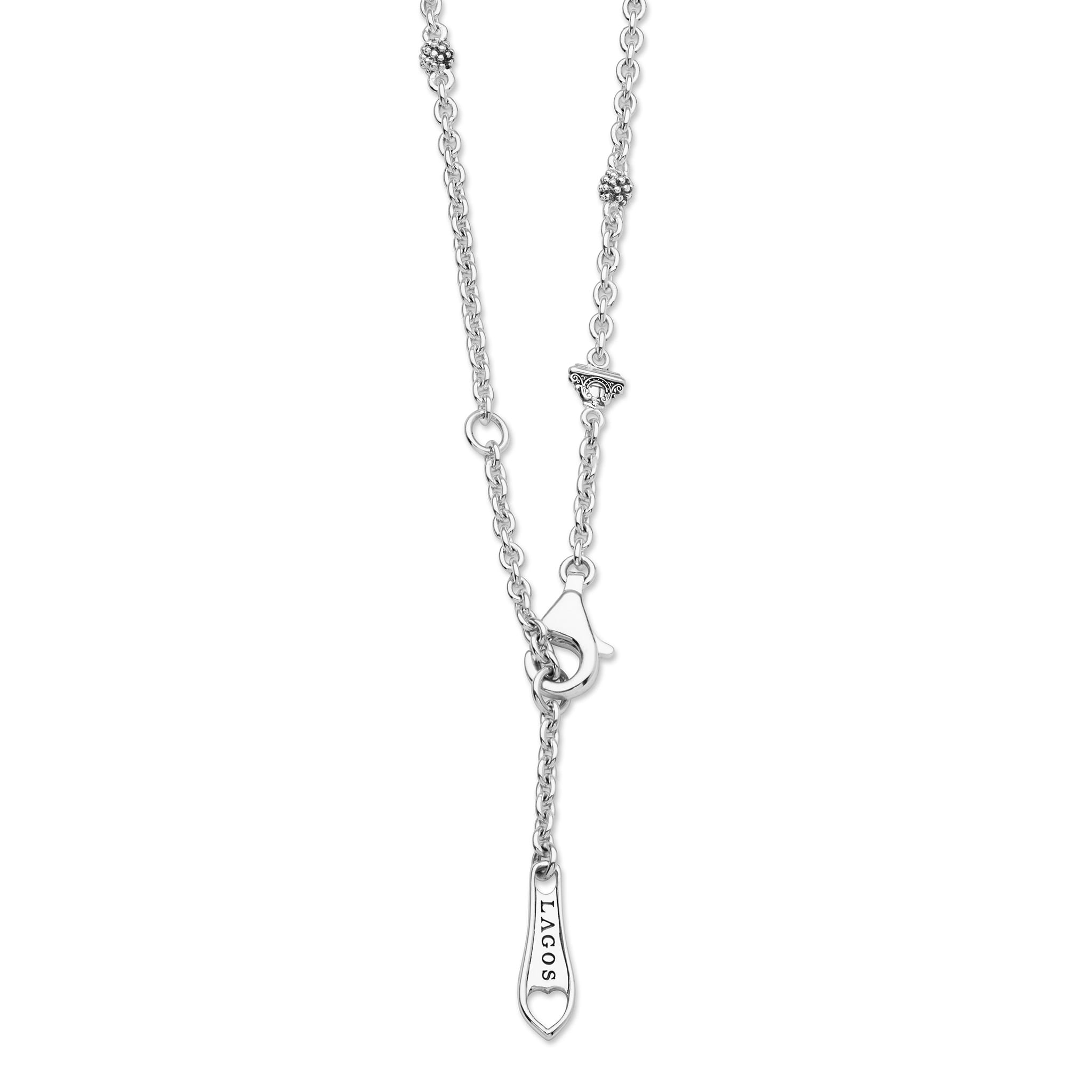 Signature Caviar Two-Tone Swiss Blue Topaz Oval Pendant Necklace with sterling silver chain, 14K gold accents, and lobster-claw clasp, featuring a LAGOS tag.