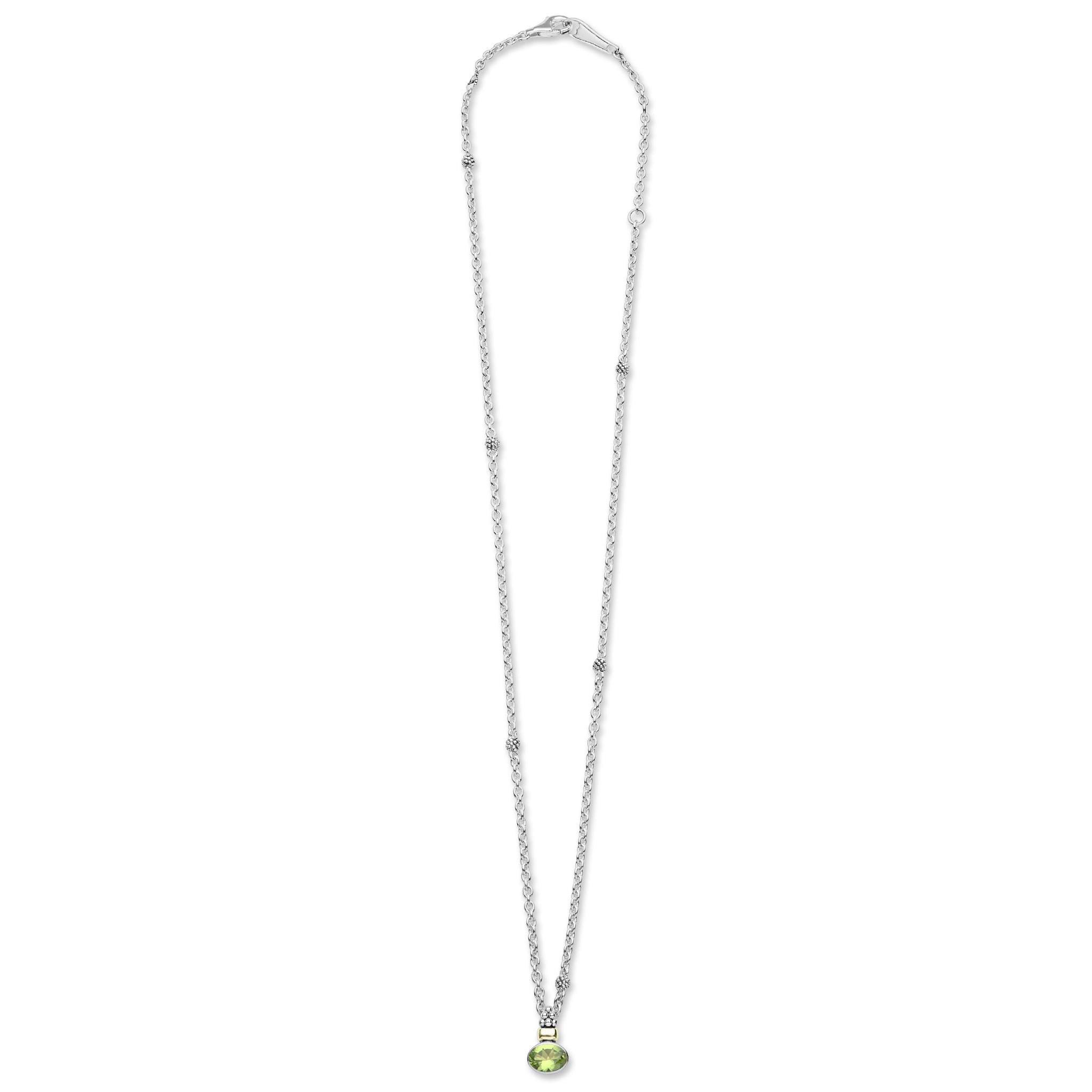 Signature Caviar Two-Tone Peridot Oval Pendant Necklace features a sterling silver chain with caviar beading, highlighted by an 18K gold-accented, bezel-set oval peridot gemstone.