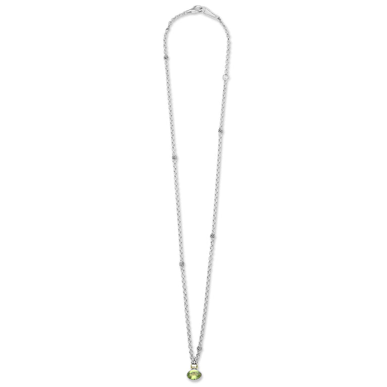 Signature Caviar Two-Tone Peridot Oval Pendant Necklace features a sterling silver chain with caviar beading, highlighted by an 18K gold-accented, bezel-set oval peridot gemstone.