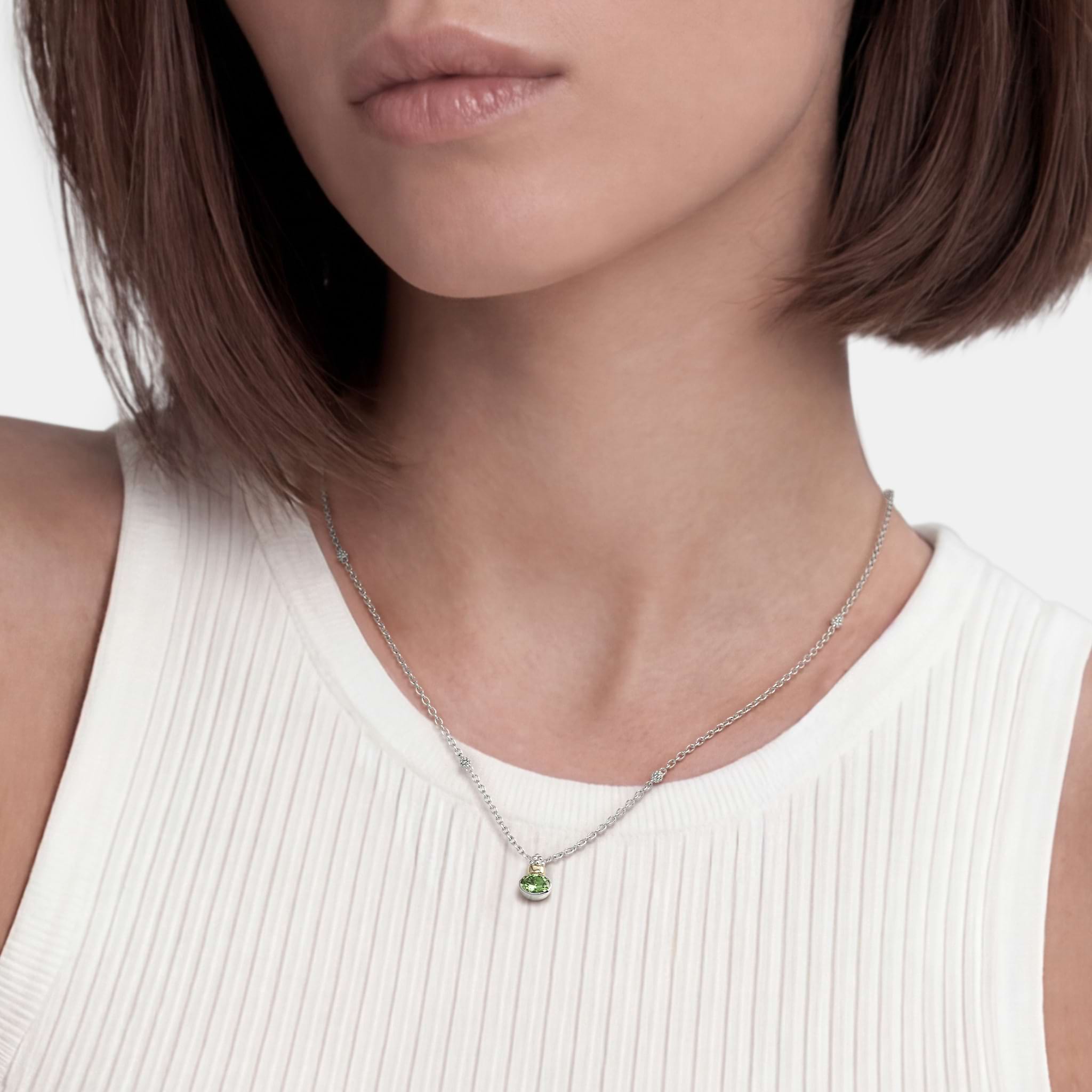 Woman wearing a Two-Tone Peridot Oval Pendant Necklace
