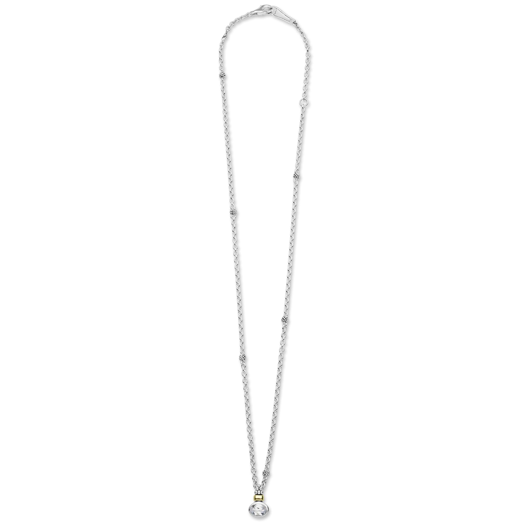 Signature Caviar Two-Tone White Topaz Oval Pendant Necklace featuring a delicate long chain with bead accents and a topaz drop pendant in silver and gold detail.