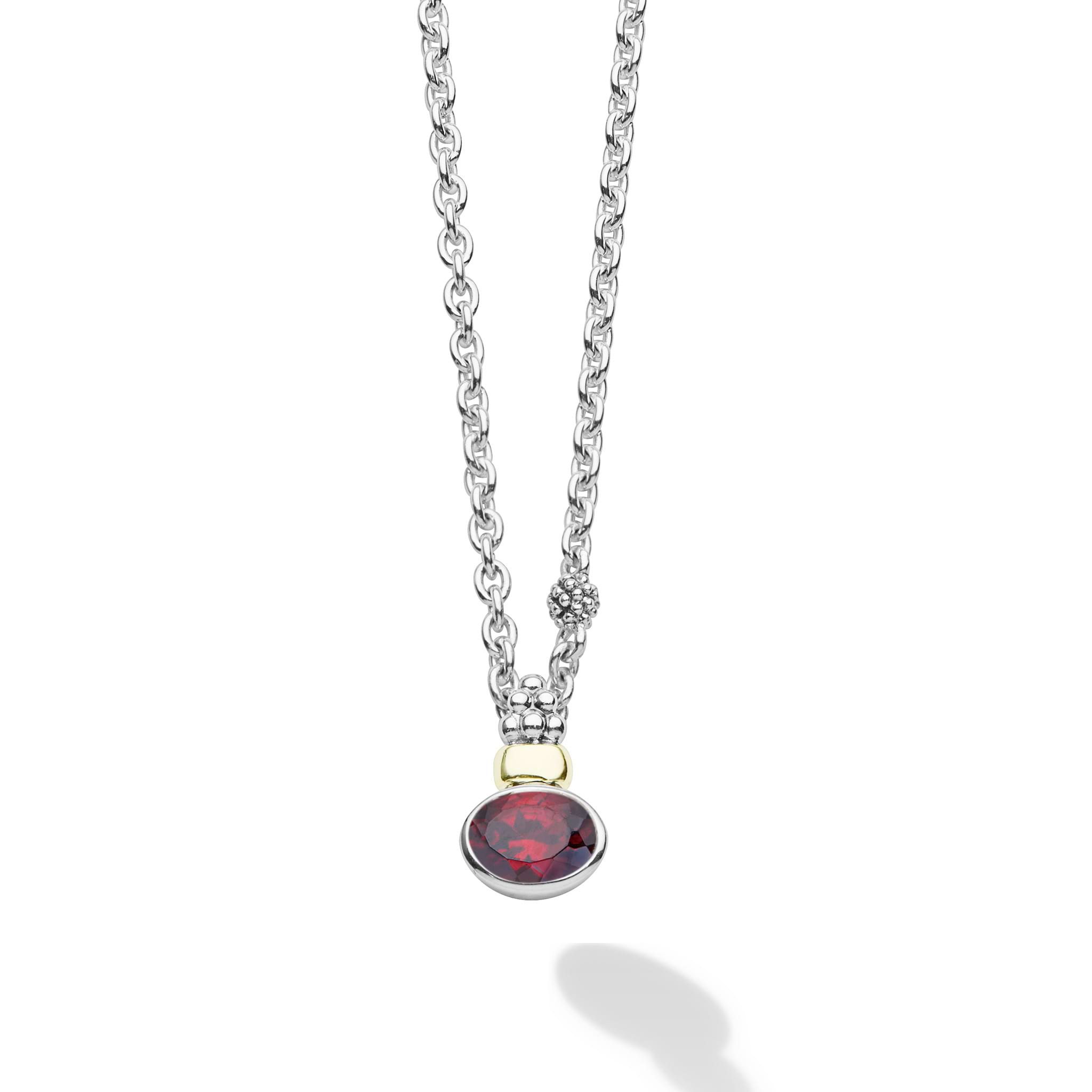 Signature Caviar Two-Tone Garnet Oval Pendant Necklace with a deep red garnet, sterling silver chain, and 18K gold-accented bead cap.