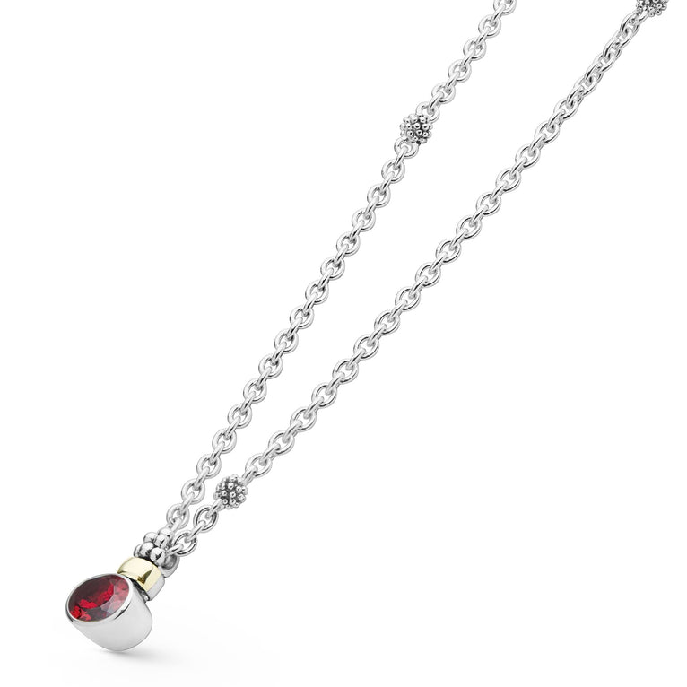 Signature Caviar Two-Tone Garnet Oval Pendant Necklace features a faceted red gemstone in a sterling silver bezel with 18K gold accents on an adjustable chain.