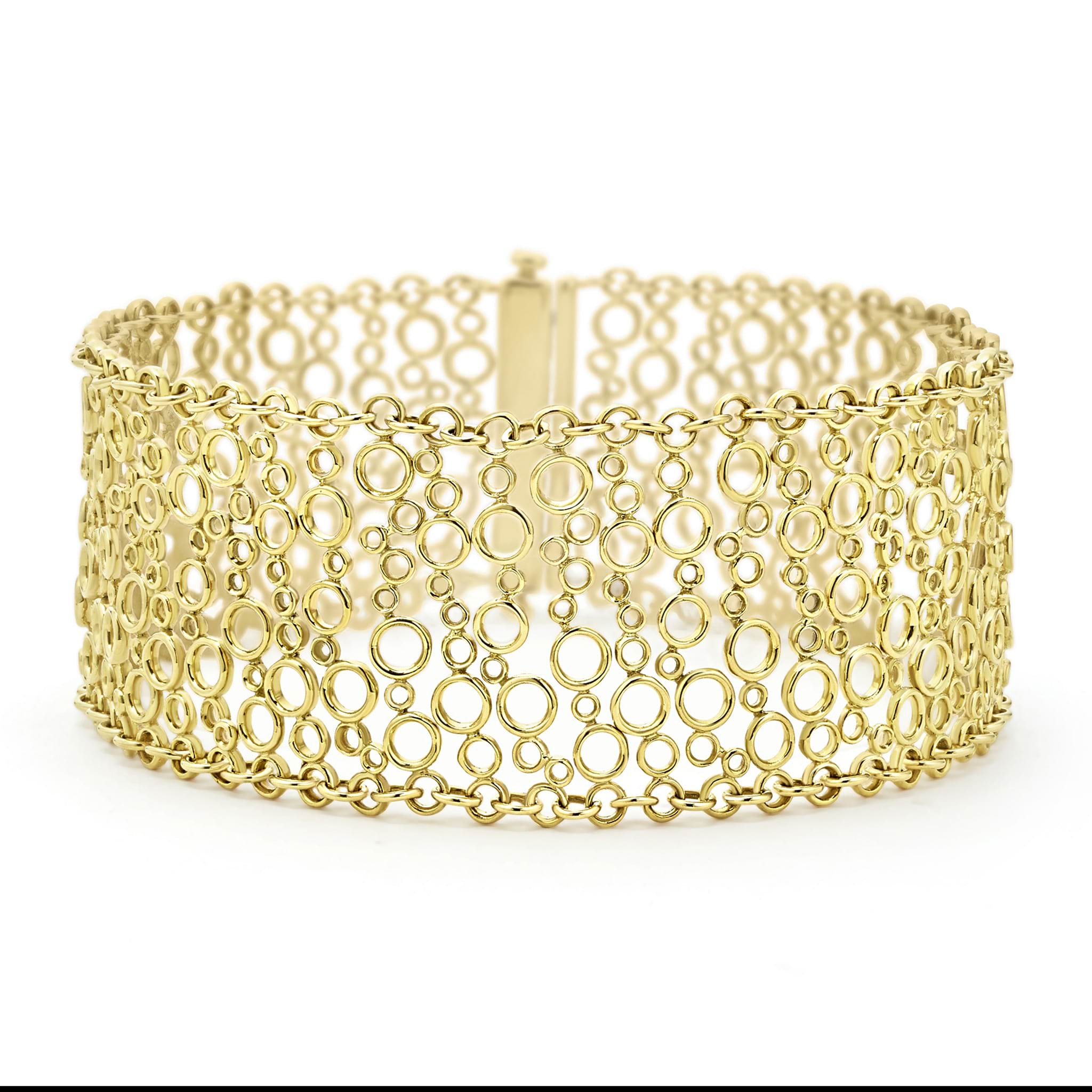 Smooth 18K gold circles form this dramatic cuff bracelet.