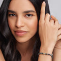 Caviar Icon Hematite Gold Station Bead Bracelet on womans wrist, showcasing elegance and LAGOS quality craftsmanship.