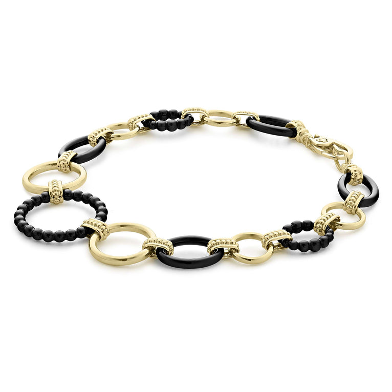 Meridian 18K Gold and Black Ceramic Link Bracelet features alternating textured gold and enamel-coated black links, showcasing elegance and craftsmanship.