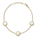 An 18k gold bracelet including three Mother of Pearl inlay stations with Caviar beaded details.