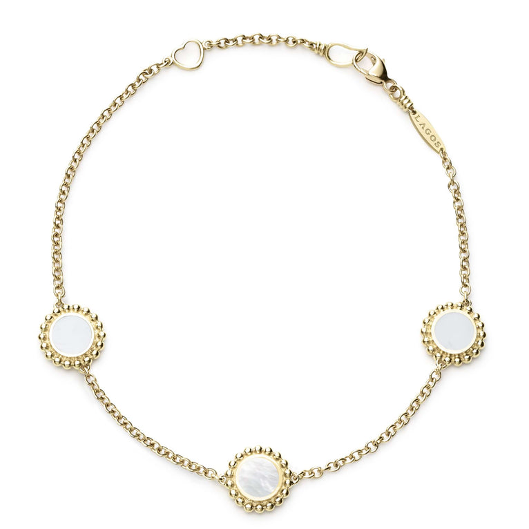 An 18k gold bracelet including three Mother of Pearl inlay stations with Caviar beaded details.