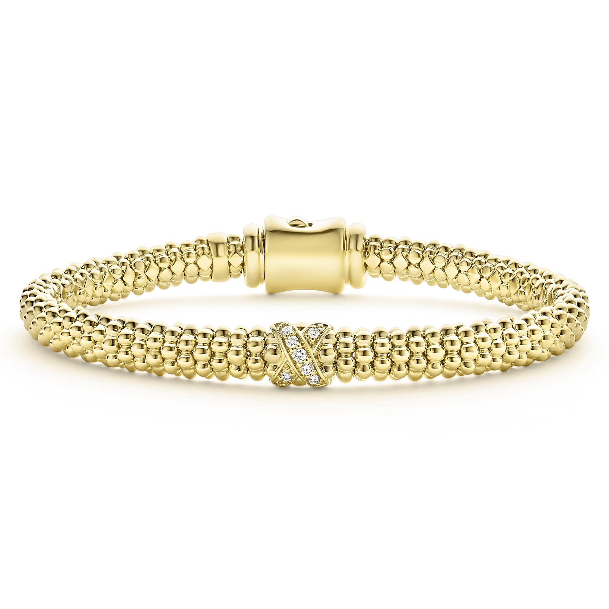 An 18K gold diamond X station wraps this Caviar beaded bracelet. LAGOS diamonds are the highest quality natural stones.