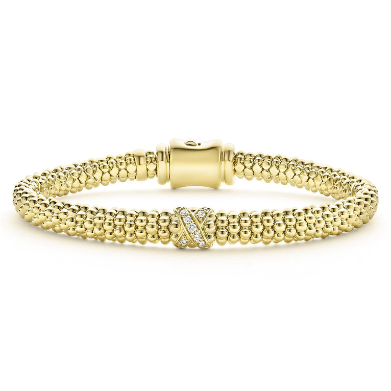 An 18K gold diamond X station wraps this Caviar beaded bracelet. LAGOS diamonds are the highest quality natural stones.