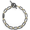18K gold variations of Caviar beading & black ceramic form this bold link bracelet.