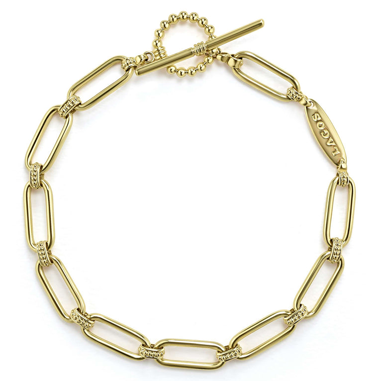 18K gold variations of Caviar beading & fluting elements form this bold link bracelet.