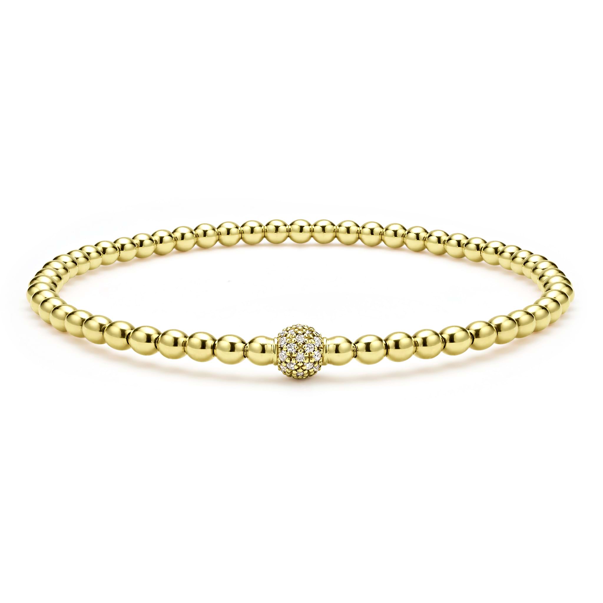 A single pavé diamond sphere on an 18K gold Caviar beaded stretch bracelet.