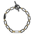 18K gold variations of Caviar beading and black ceramic accented by a single diamond station forms this bold link bracelet. LAGOS diamonds are the highest quality natural stones.