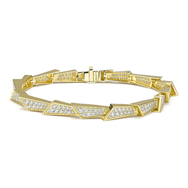 Featuring a sleek linear design adorned with sparkling diamonds, crafted from 18K Caviar gold, this bracelet offers timeless sophistication. Perfect for stacking or wearing solo.
