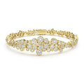 cluster diamond tennis bracelet set in 18K gold with LAGOS engraving on white background