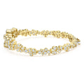 side of cluster diamond tennis bracelet set in 18K gold on white background 